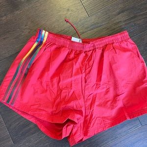 Red adidas shorts with the crinkle material size xl